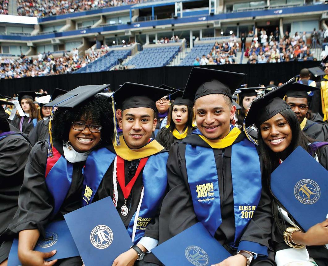 four students at commencement