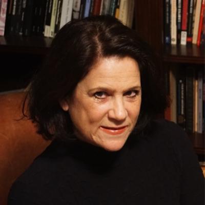 woman in front of bookcase